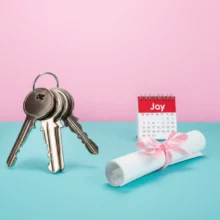 Pile-of-keys,-contract,-and-calendar-representing-the-housing-contract-reporting-obligation-and-deadline.