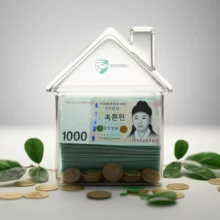 투명한-돼지-저금통-안에-한국-돈이-가득-쌓여있고,-주변에-초록-잎사귀가-있는-모습.-경기도-청년노동자-통장을-통해-자산이-불어나는-것을-상징합니다.