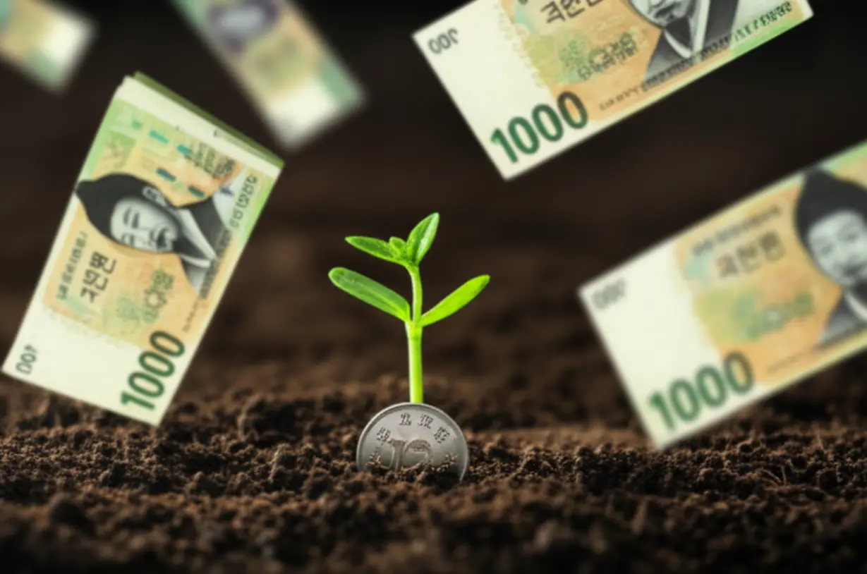 작은-동전에서-새싹이-자라나는-모습.-경기도-청년노동자-통장이-자녀의-자산-성장을-돕는다는-의미를-담고-있습니다.