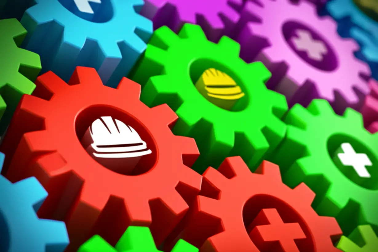 안전의-중요성을-나타내는-귀여운-3D-이미지.-서로-맞물려-돌아가는-여러-색깔의-톱니바퀴들이-안전모와-구급상자-아이콘과-함께-어우러져,-모든-안전-요소가-유기적으로-연결되어-있음을-보여줍니다.-(산업현장-안전,-안전의-중요성)